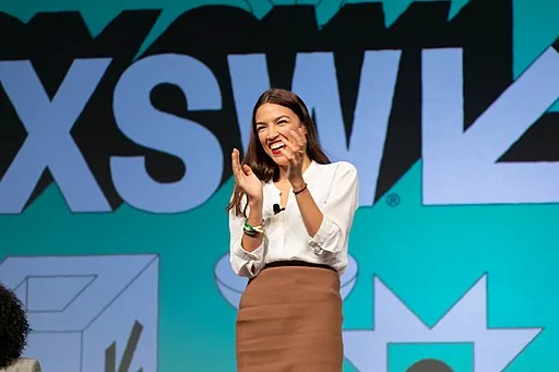Alexandria Ocasio-Cortez clapping on stage @ SXSW 2019