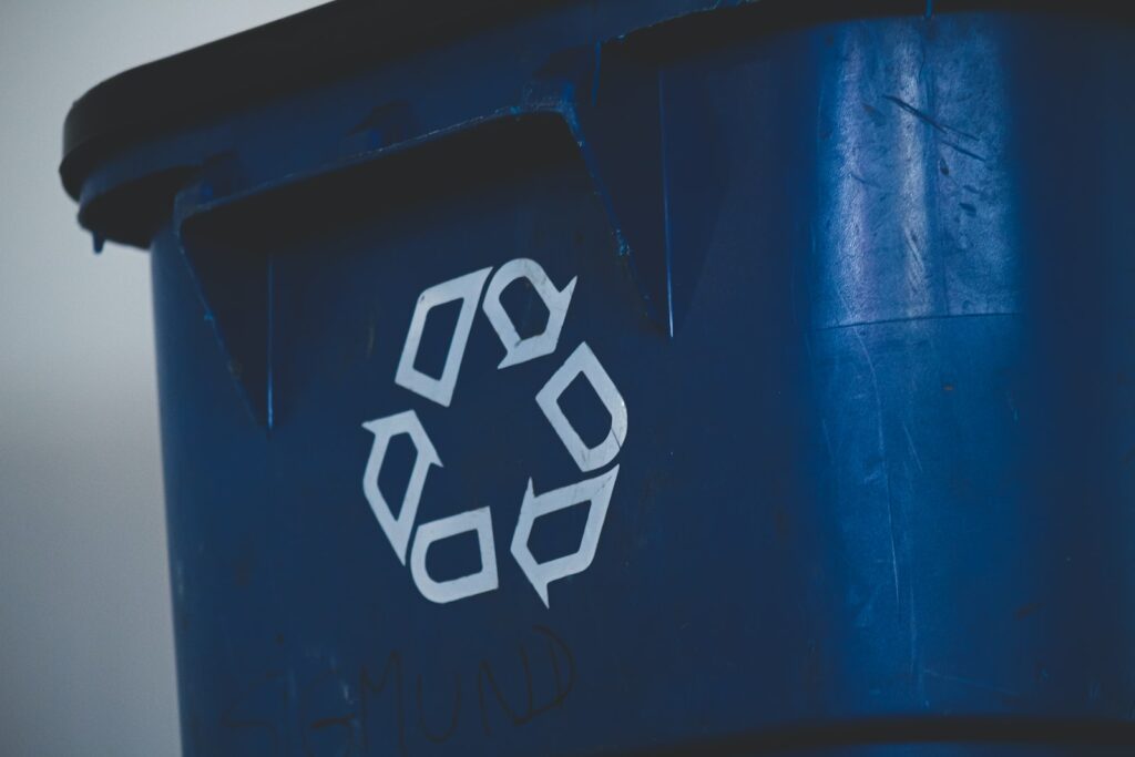 closup picture of a blue recycling bin
